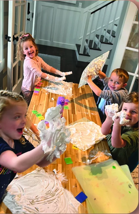 Preschool students enjoying a hands-on sensory activity together